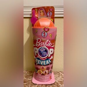 BARBIE POP REVEAL with Pink and Orange Accents; 8 surprises included.